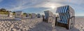 Beach with Canopied beach chairs in evening light Royalty Free Stock Photo